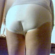 A video clip of a woman pooping her white panties, and we get to see the growing bulge.